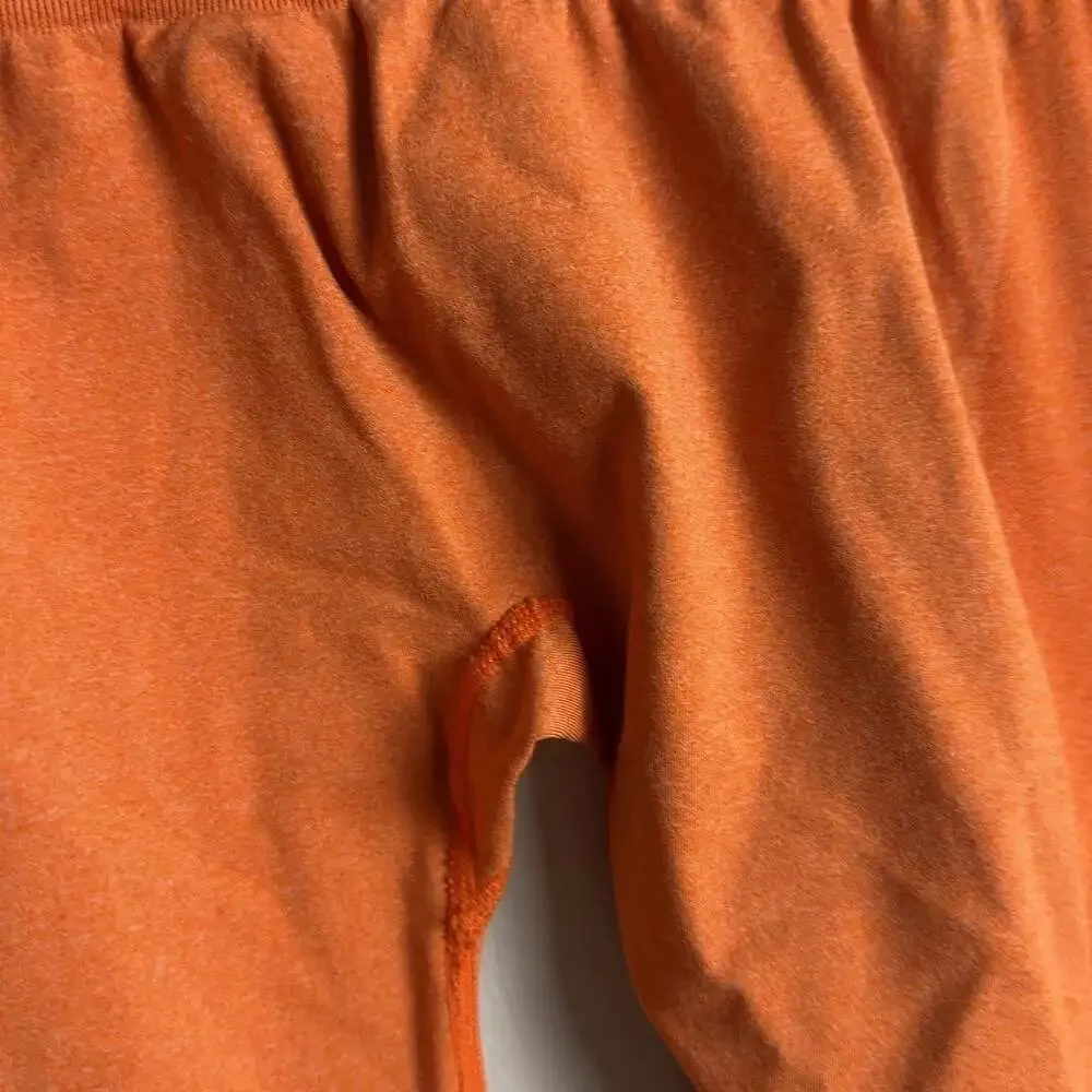 NVGTN Seamless High Waisted Leggings Size Medium Orange Athletic Gym Women’s
